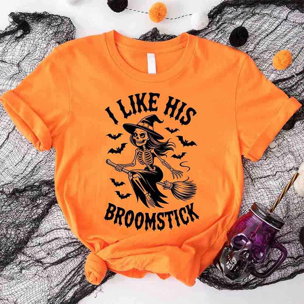 Orange Halloween T-shirt with black witch skeleton graphic and “I Like His Broomstick” text