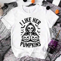 White unisex T-shirt with “I LIKE HER PUMPKINS” skull and jack-o’-lantern graphic