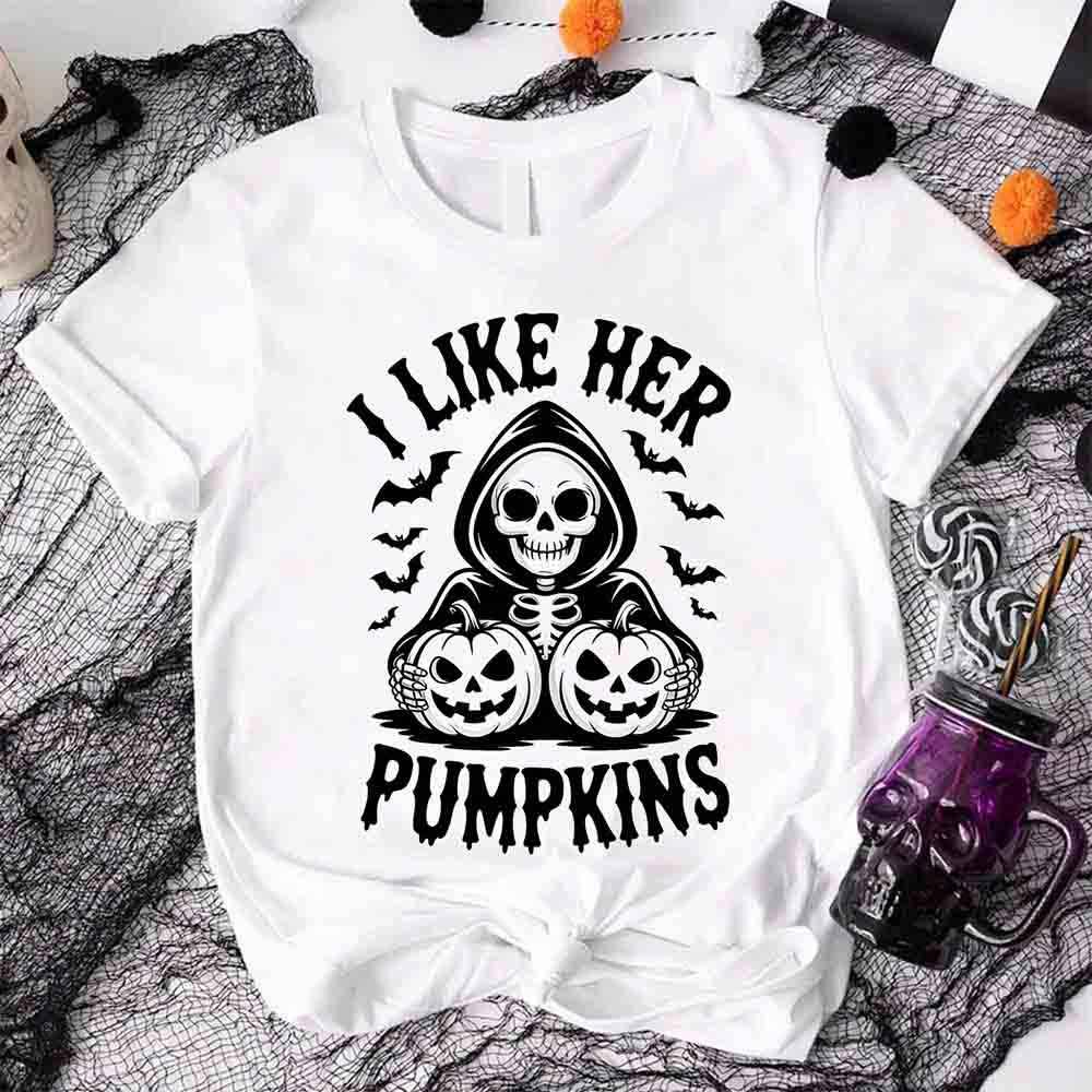White unisex T-shirt with “I LIKE HER PUMPKINS” skull and jack-o’-lantern graphic