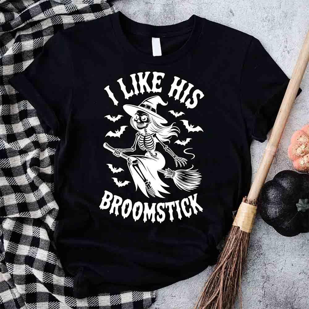 Black Halloween T-shirt with white witch skeleton graphic and “I Like His Broomstick” text