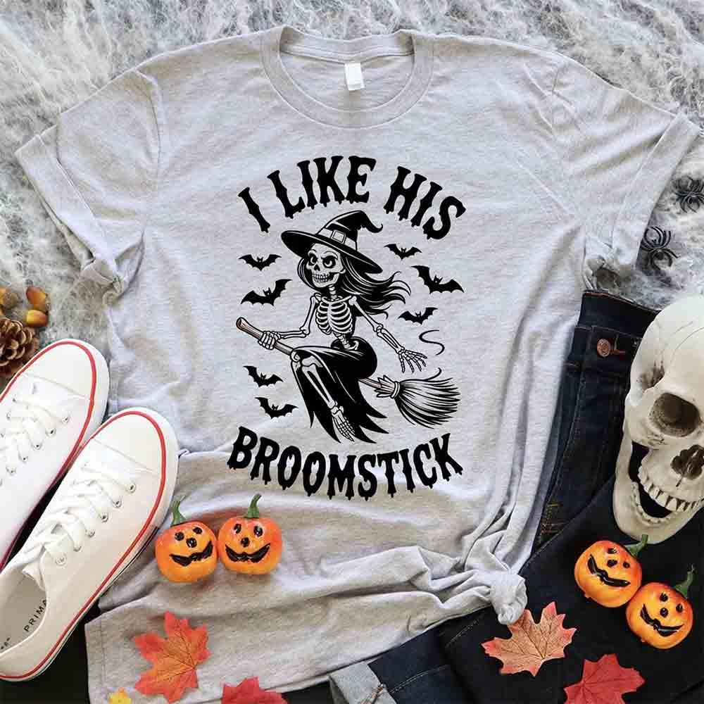 Light gray Halloween T-shirt with witch skeleton graphic and “I Like His Broomstick” text