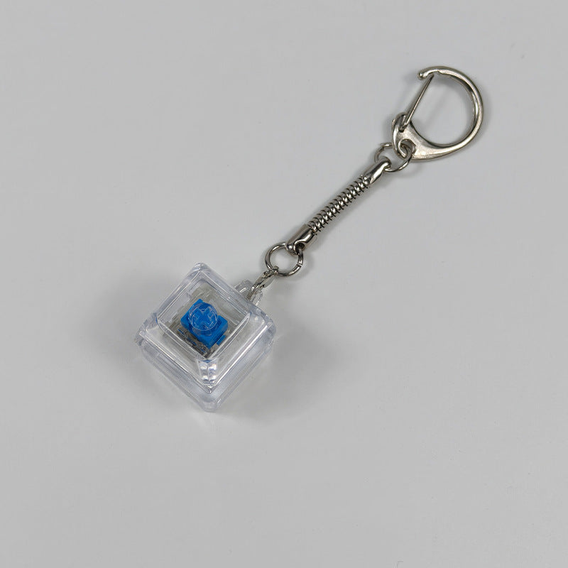 Clear square finger-popping stress-relief keychain toy with blue button and metal chain