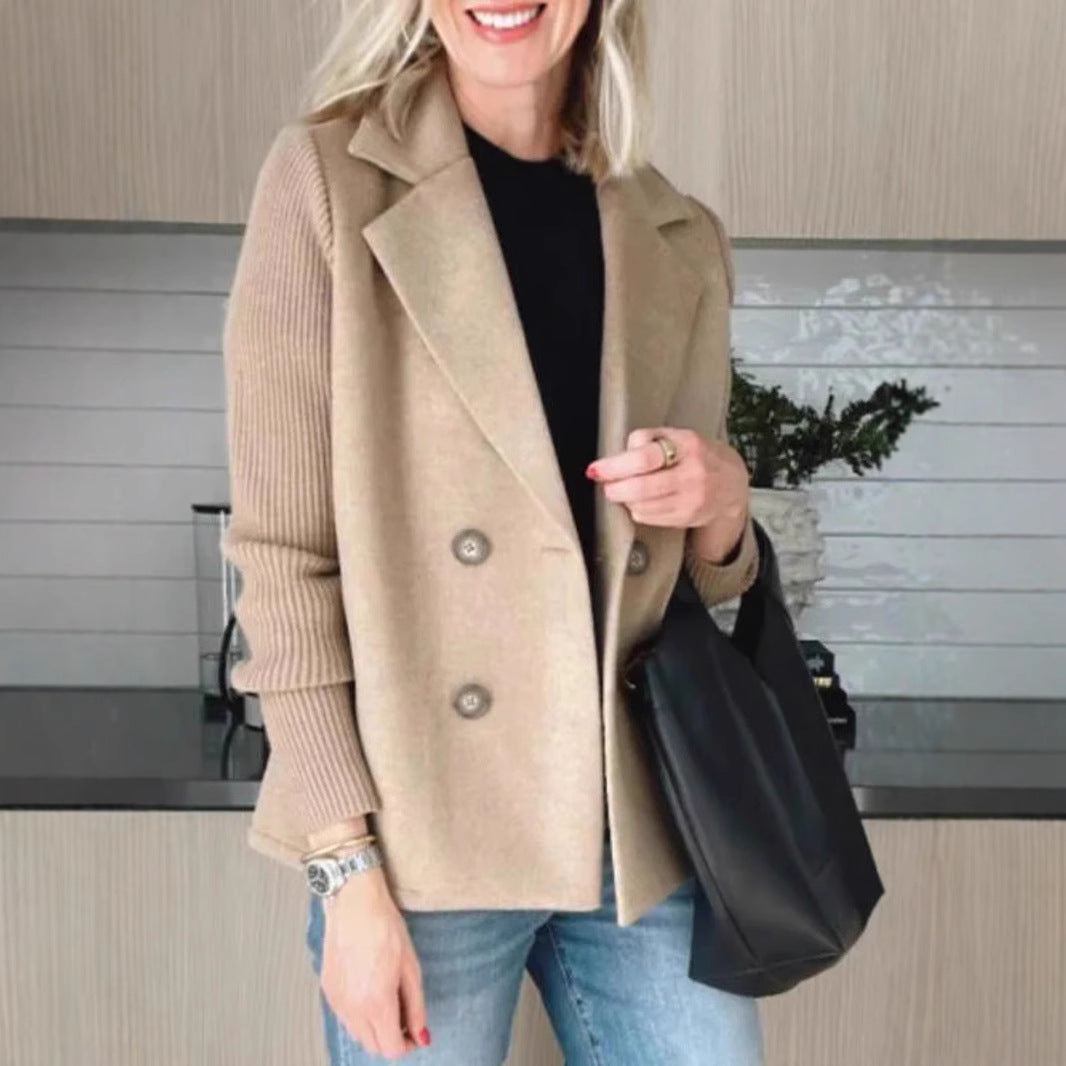 Tan double-breasted lapel jacket with knit sleeves and two-button front, structured shoulders.