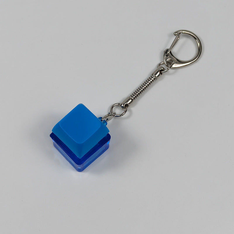 Bright blue square finger-popping stress-relief keychain toy with metal chain and rings