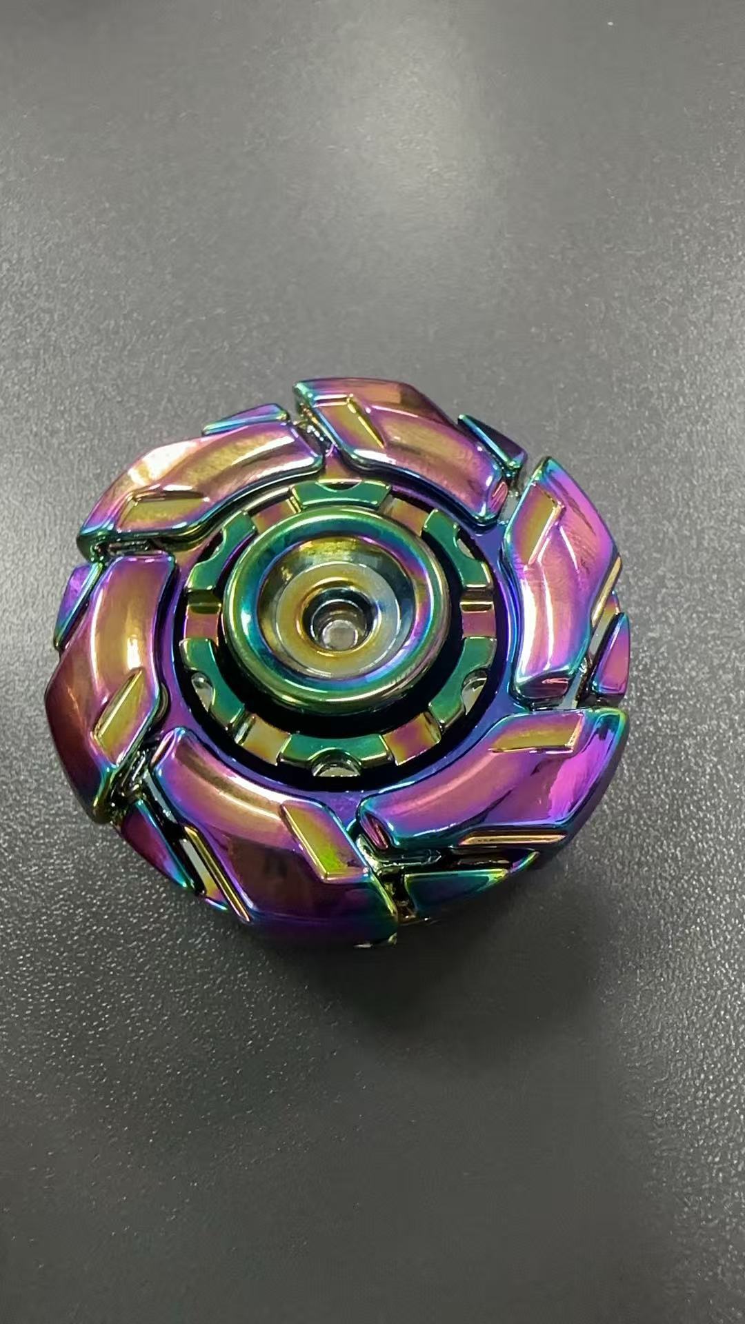 Iridescent rainbow fingertip gyro decompression toy with circular core and metal blade segments