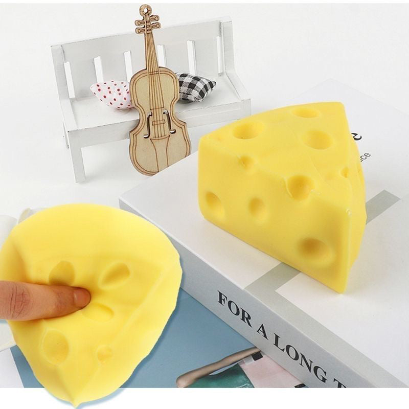 Yellow cheese wedge squishy toy with round holes, two pieces