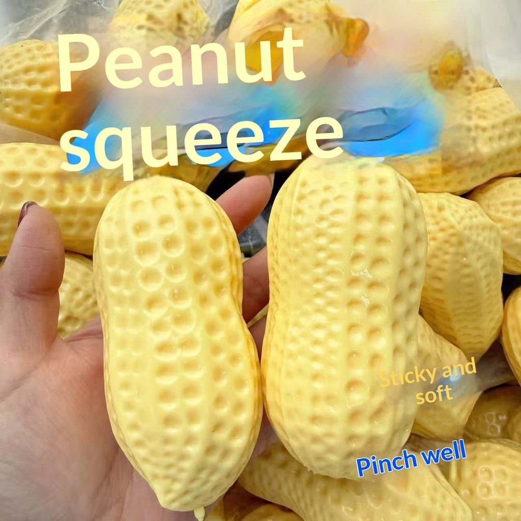 Yellow bumpy peanut squeeze stress toy held in two fingers