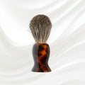 Badger hair shaving brush with tortoiseshell-pattern handle and dense bristles
