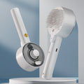 Pet grooming spray comb with UVC sterilization, white handheld with circular charging base
