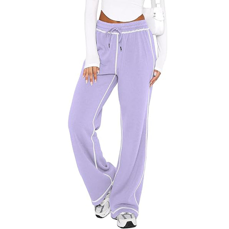 Lavender jogger sweatpants with drawstring, elastic waist, and white side stripe