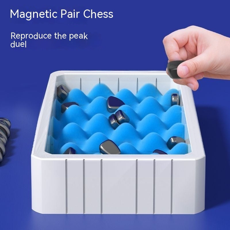 Magnetic pair chess tray with blue magnets and a hand picking up a piece
