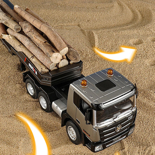Gray RC flatbed truck with trailer, front wheel detail and logs on the flatbed