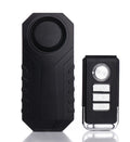 Black vibration anti-theft alarm sensor with matching remote control fob