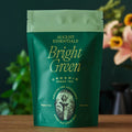 August Essentials Bright Green organic green tea pouch, green front with foil top