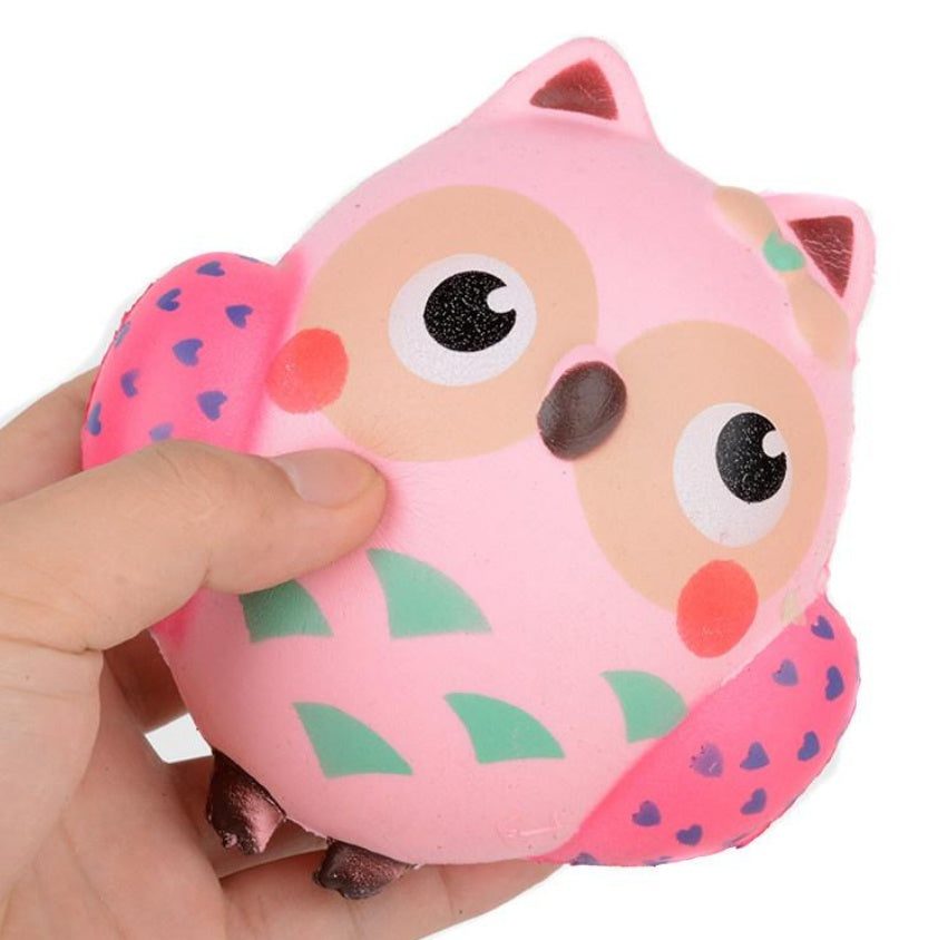 Slow-rising squishy toy pink pig with cartoon face and moon detail