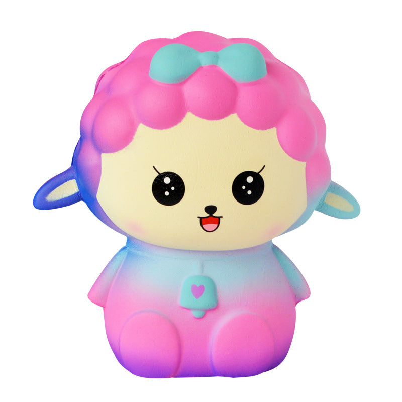 Cute plush animal toy with pink and turquoise hood, teal face, big black eyes.