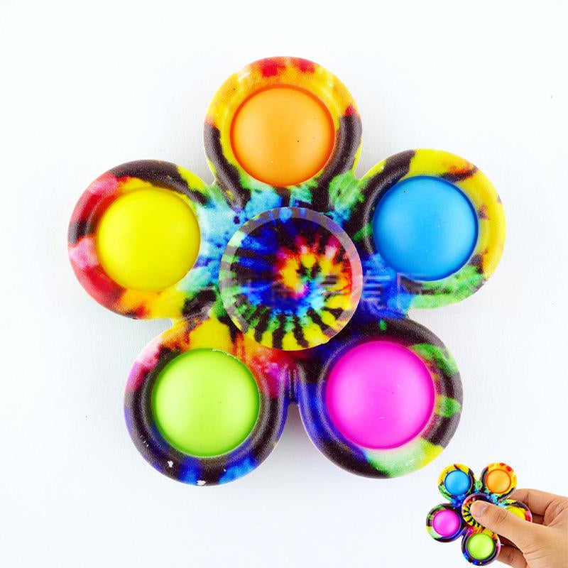 Tie-dye fidget spinner with six multicolor printed buttons and circular spiral center disc.