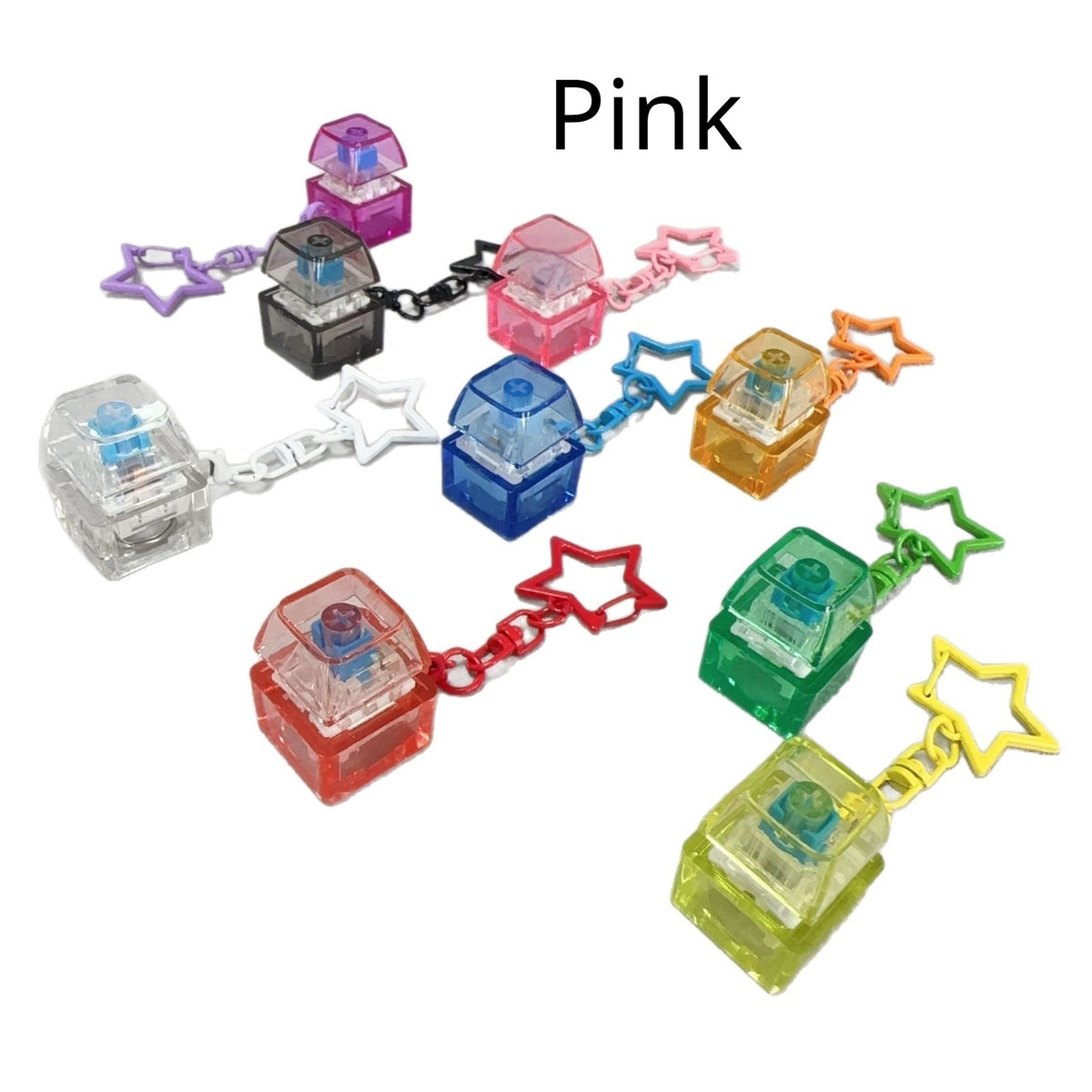 Pink cube mechanical keyboard stress-relief keychain set with star charms