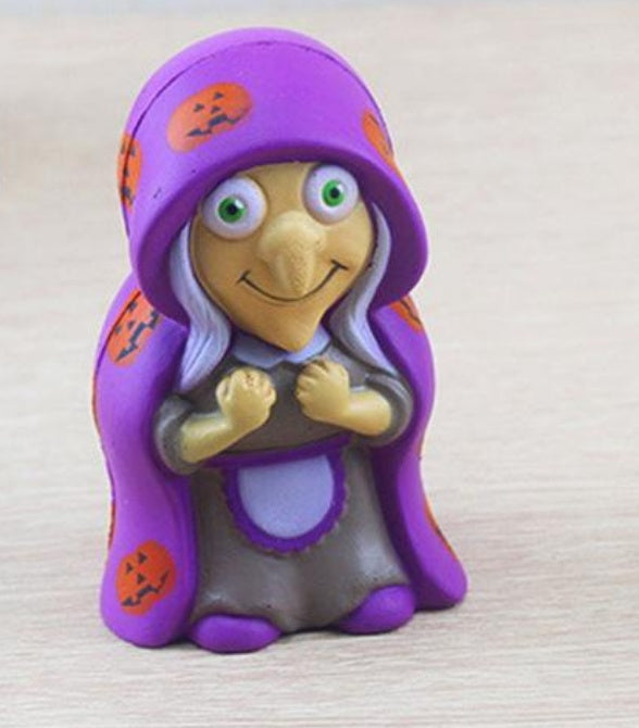 Purple witch slow-rising squishy toy with hood, big eyes, and orange star details