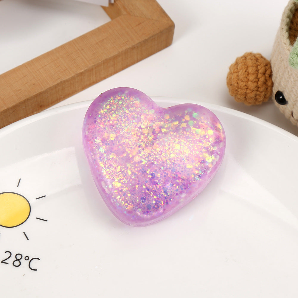 Purple glitter heart squeeze stress toy