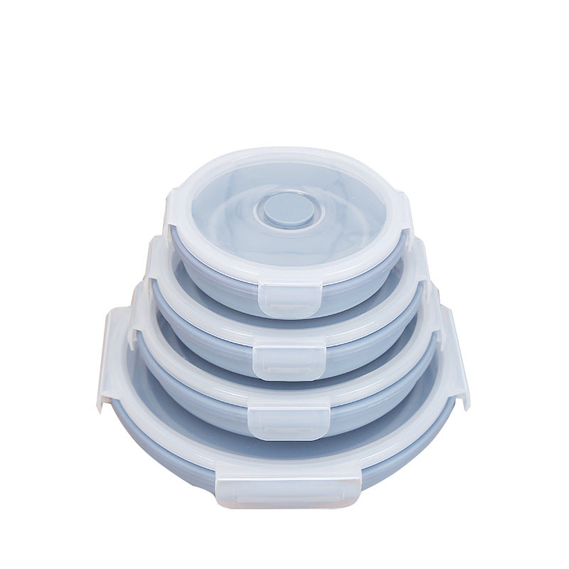Stack of light blue silicone lunch containers with clear snap lids