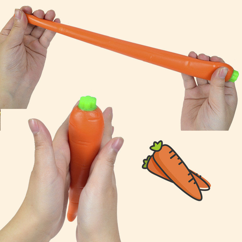 Hands holding an orange carrot-shaped stress relief toy with green cap
