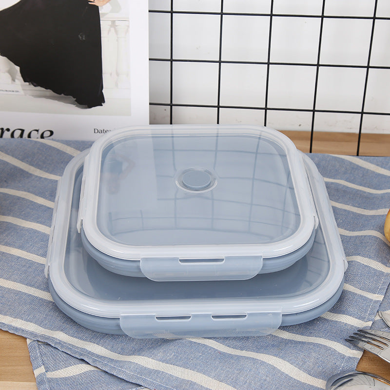 Blue silicone lunch containers with snap lids, stacked for storage