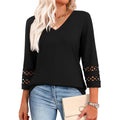 Women’s V-neck pullover top with 3/4 sleeves, loose fit, black color, patterned cuffs