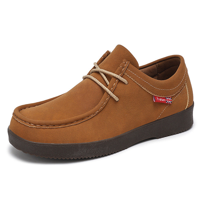 Tan suede low-top lace-up loafer with dark rubber sole and braided lace detail.