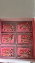 Close-up of pink-toned faux chocolate squeeze toys in clear box compartments
