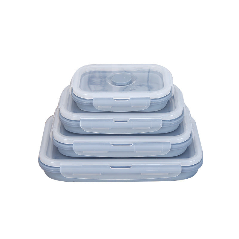 Stack of light blue silicone lunch containers with snap lids