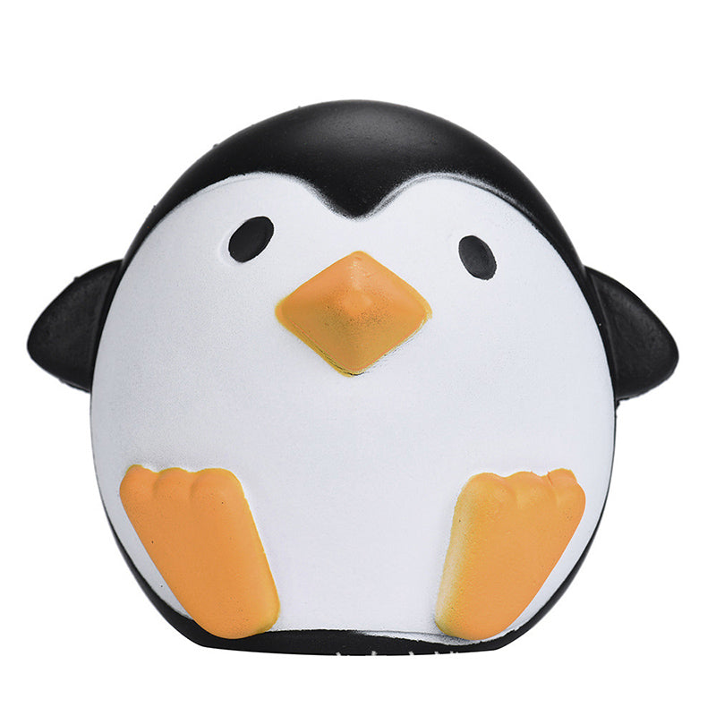 Squishy penguin-shaped plush toy with black head, white belly, orange beak and feet.