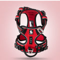 Red and black nylon dog harness vest with adjustable straps and chest buckle.