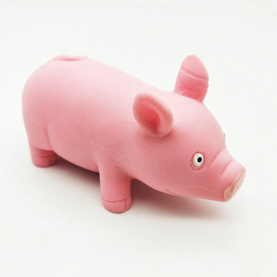 Pink pig squishy stress toy with small ears and white eye details