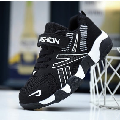 Kids' black mesh sneaker with white side panels and lace-up strap