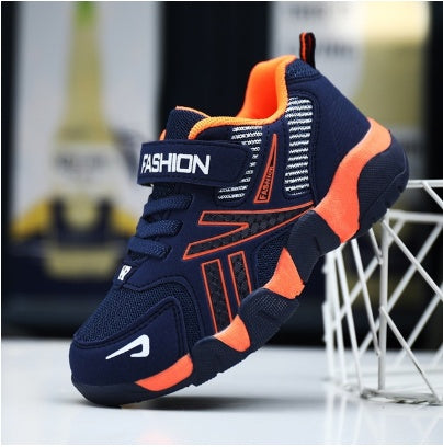 Kids' navy mesh sneaker with orange side panels and lace-up strap