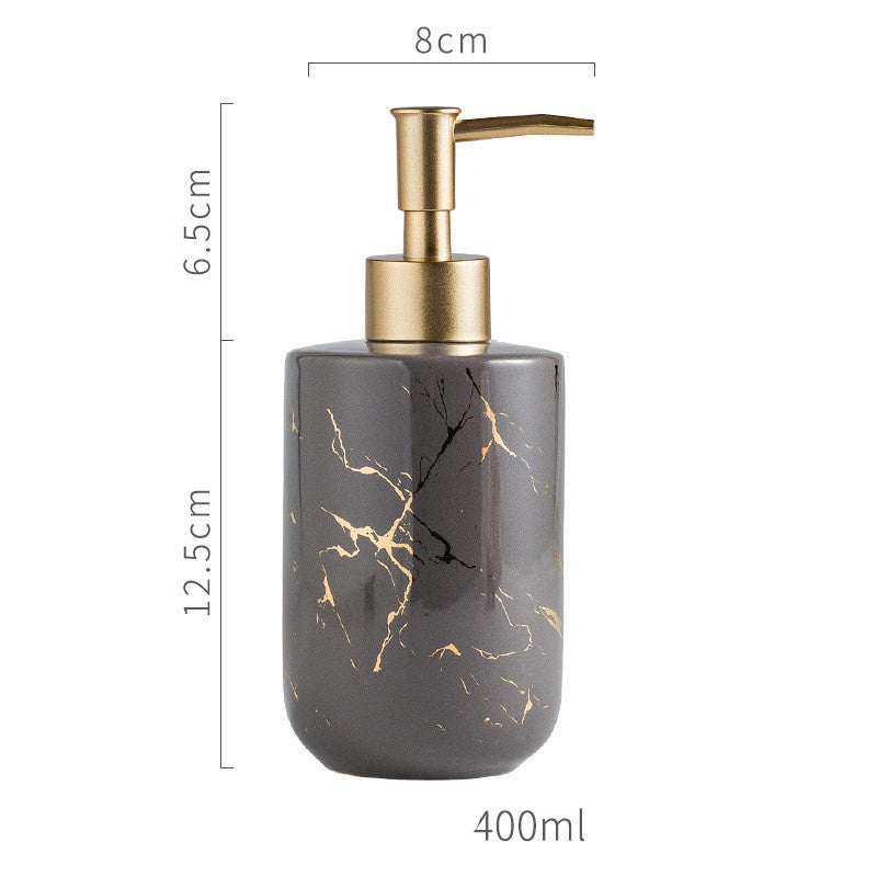 Marble-pattern dispenser bottle with gold pump; gray bottle with golden marble veining