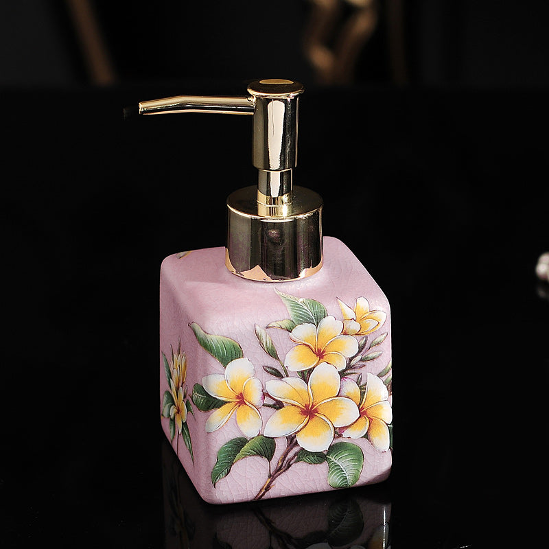 Hand-painted ceramic lotion/soap dispenser bottle, pink square with plumeria flowers and gold pump