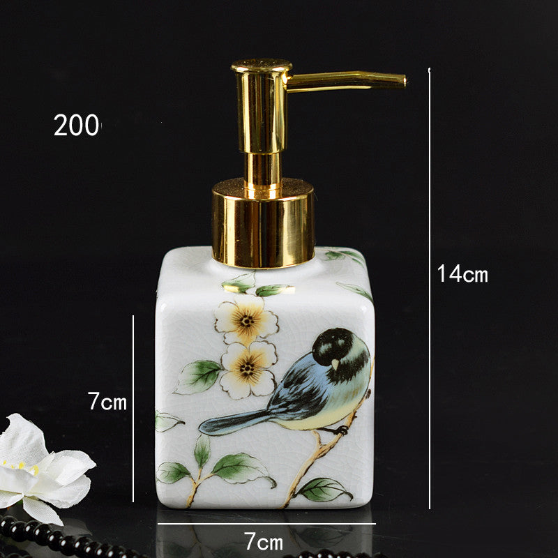 Hand-painted ceramic lotion/soap dispenser bottle, white square with yellow bird and gold pump