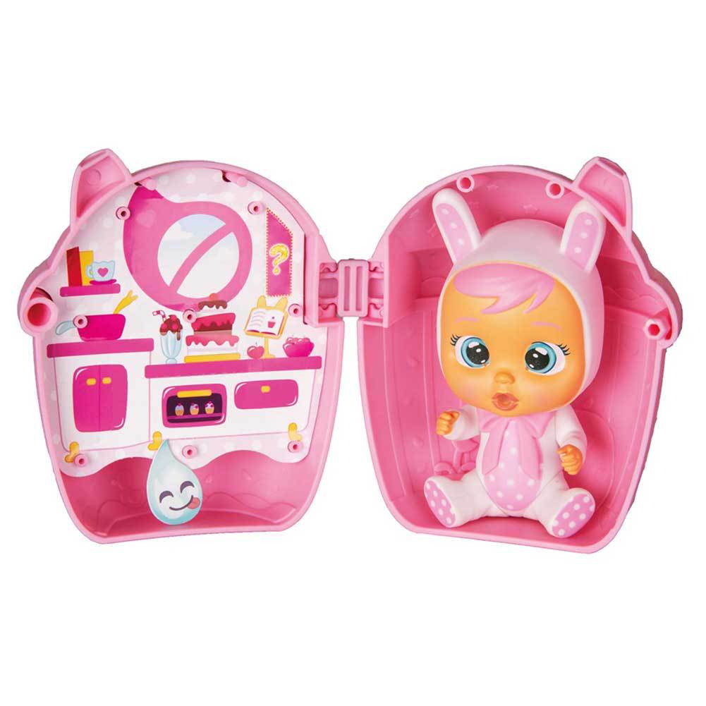 Pink crying baby doll blind box with seated baby doll inside open capsule
