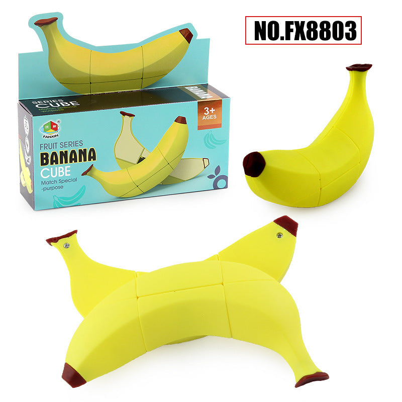 Banana-shaped puzzle cube toy in bright yellow with segmented fold-out pieces