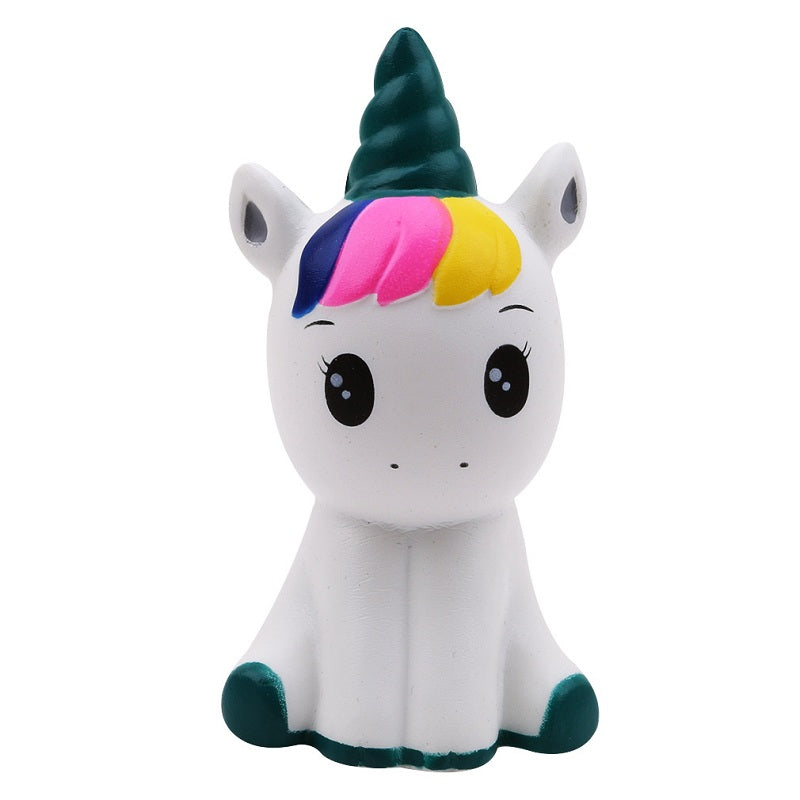 Unicorn-shaped squishy toy with teal horn, rainbow mane, and closed eyes