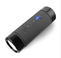 Black cylindrical Bluetooth speaker with flashlight front lens and control icons