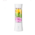 White portable electric juicer cup with transparent blending chamber and lid