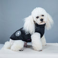 Black waterproof dog coat with harness, quilted puffer design and leash straps
