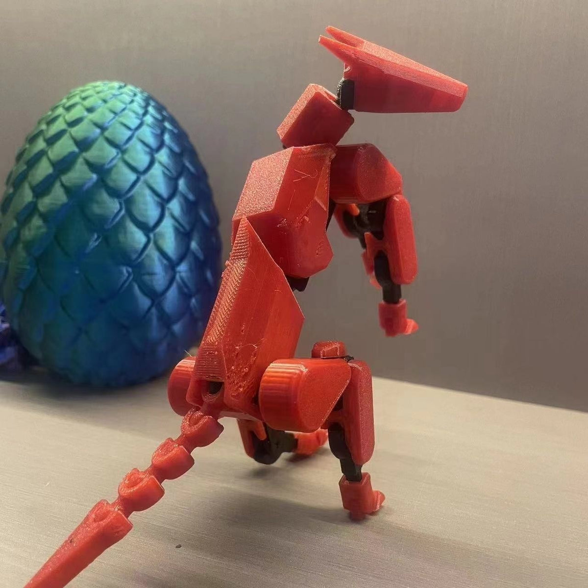 Multi-jointed robot dog action figure, red four-legged with tail and weapons