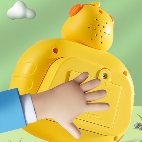 Yellow duck press-and-play toy back panel with bubble holes, close-up