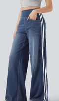 Dark blue wide-leg denim pants showing two white side stripes down the leg