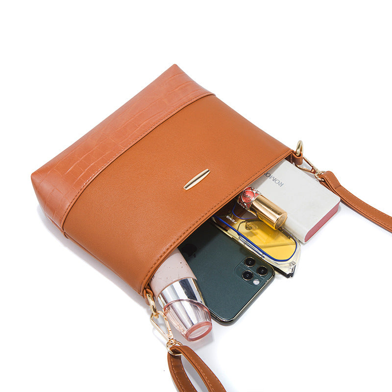 Crocodile-embossed PU handbag set in tan/orange, with tassel and phone-size pouch