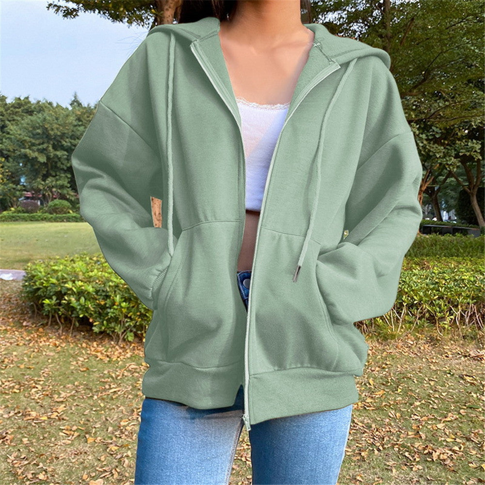 Women's hooded zip-front jacket, loose fit, green with drawstring hood and front pockets